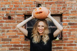 a woman grap a pumpkin